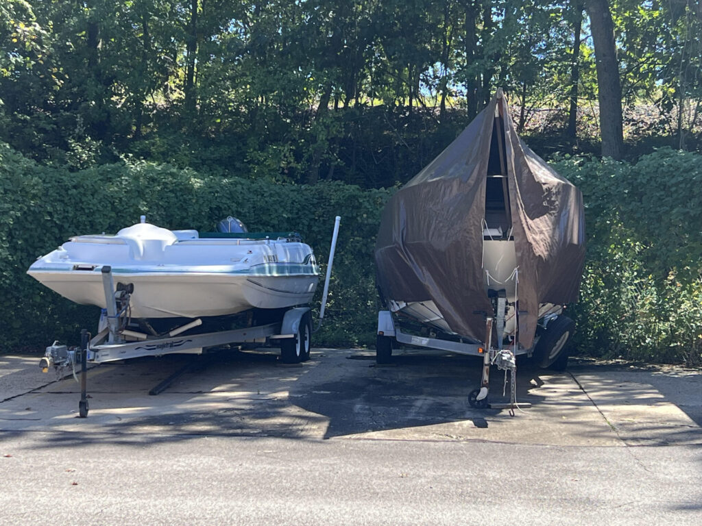 two boats storage in parking space at allied