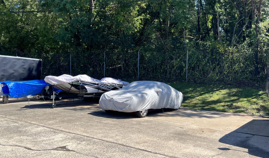 covered cars storage at parking space at allied storage facility